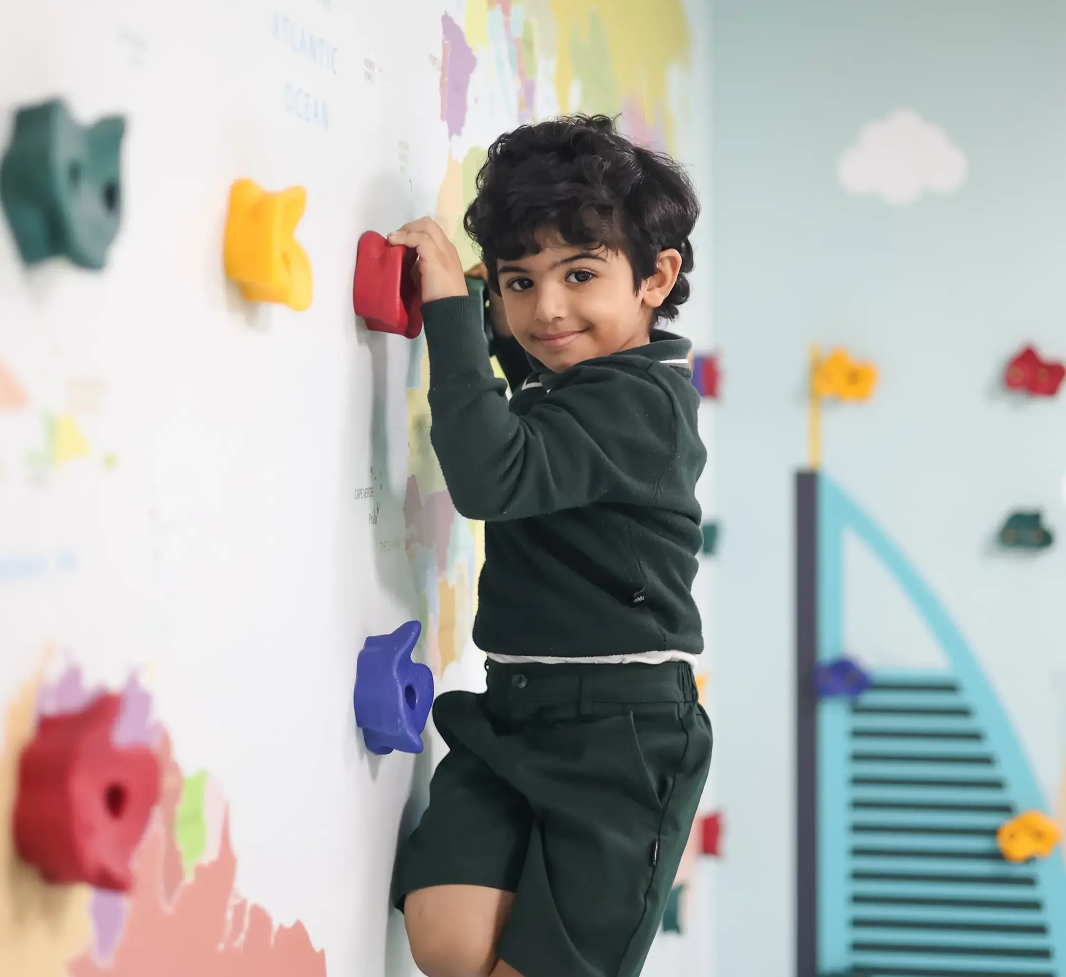 Early Years student doing wall climbing