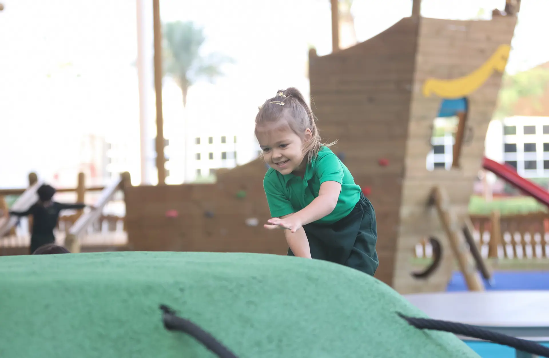 Early years student playing on playground