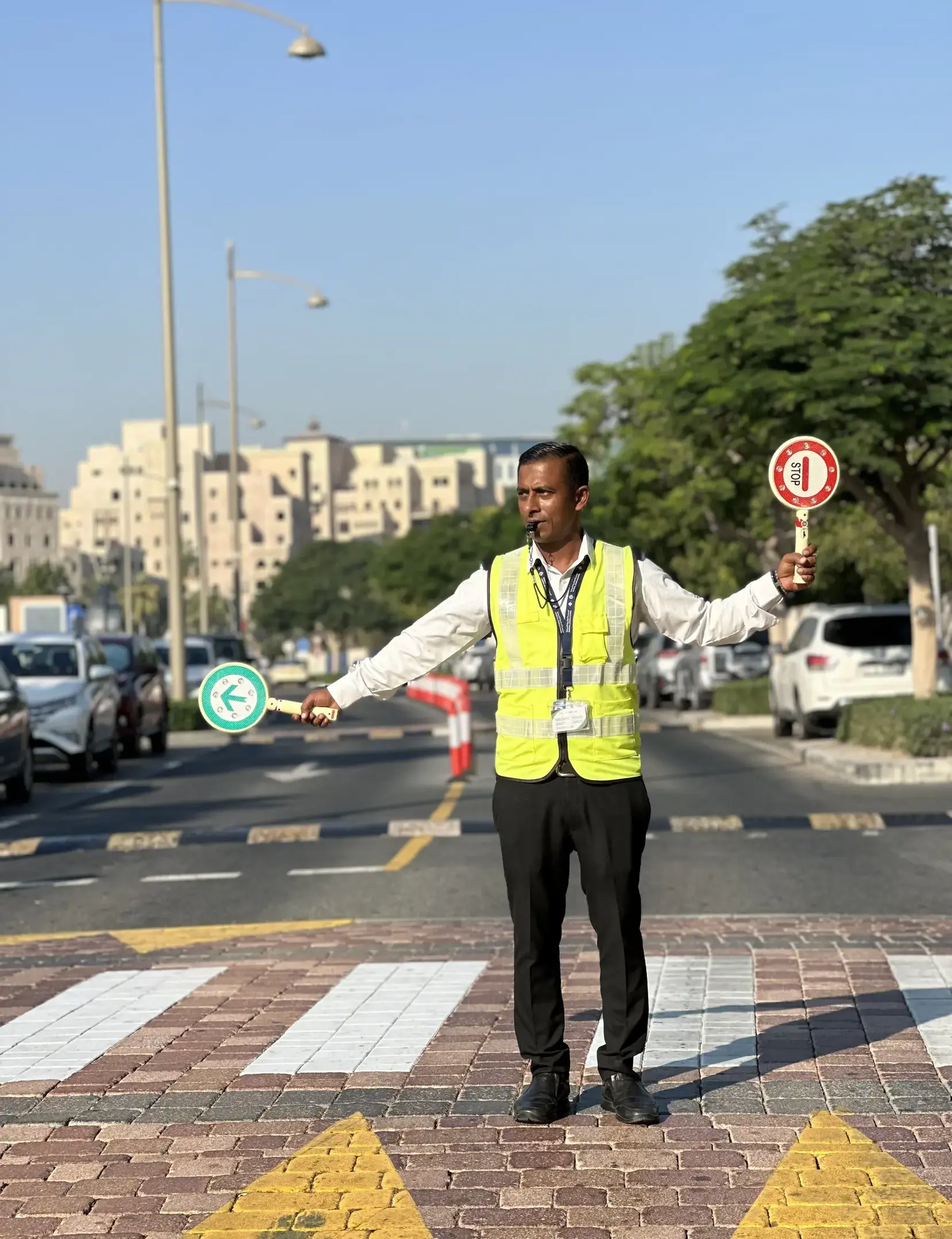 Staff member directing traffic