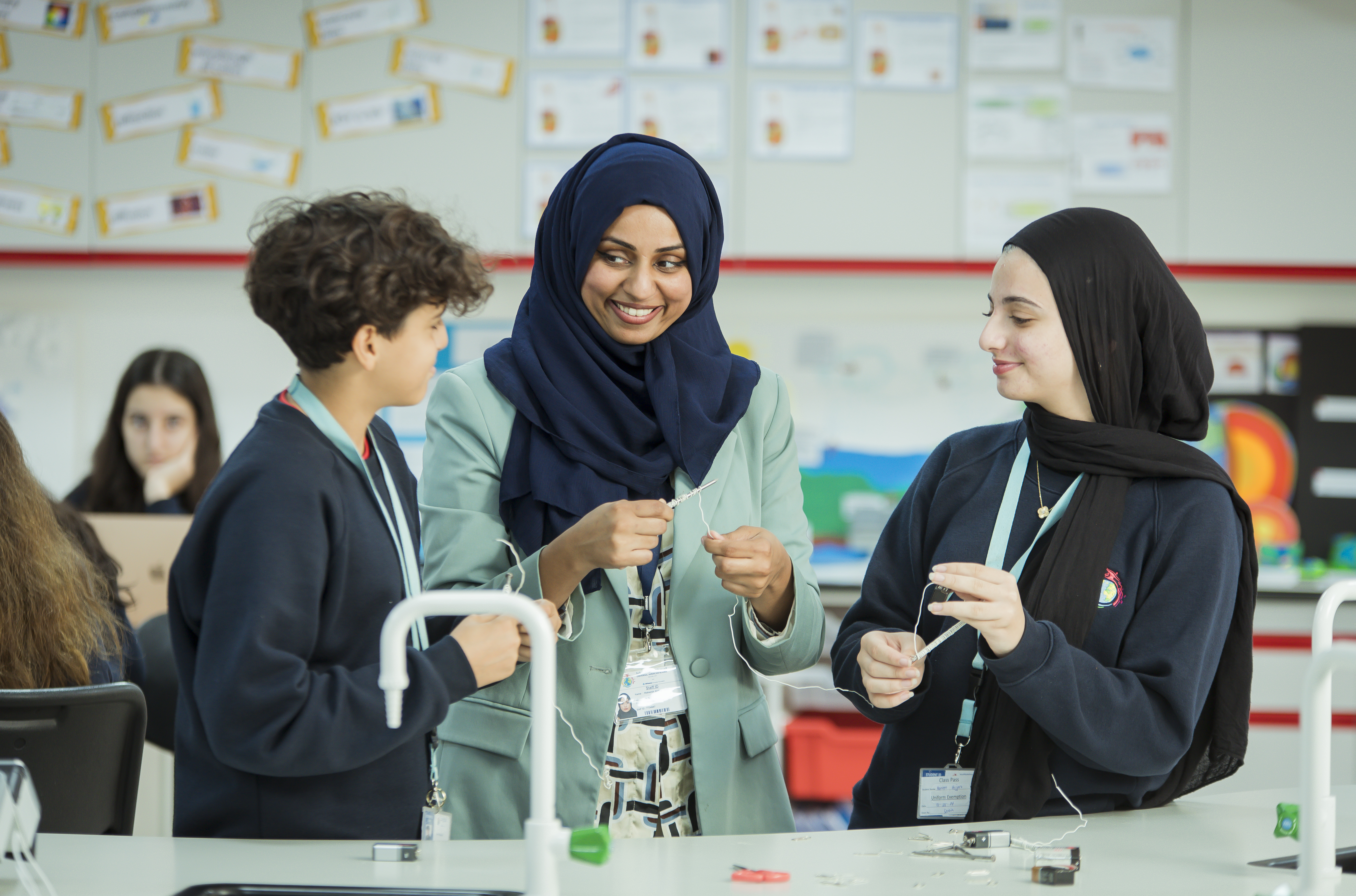Students in class smiling at each other