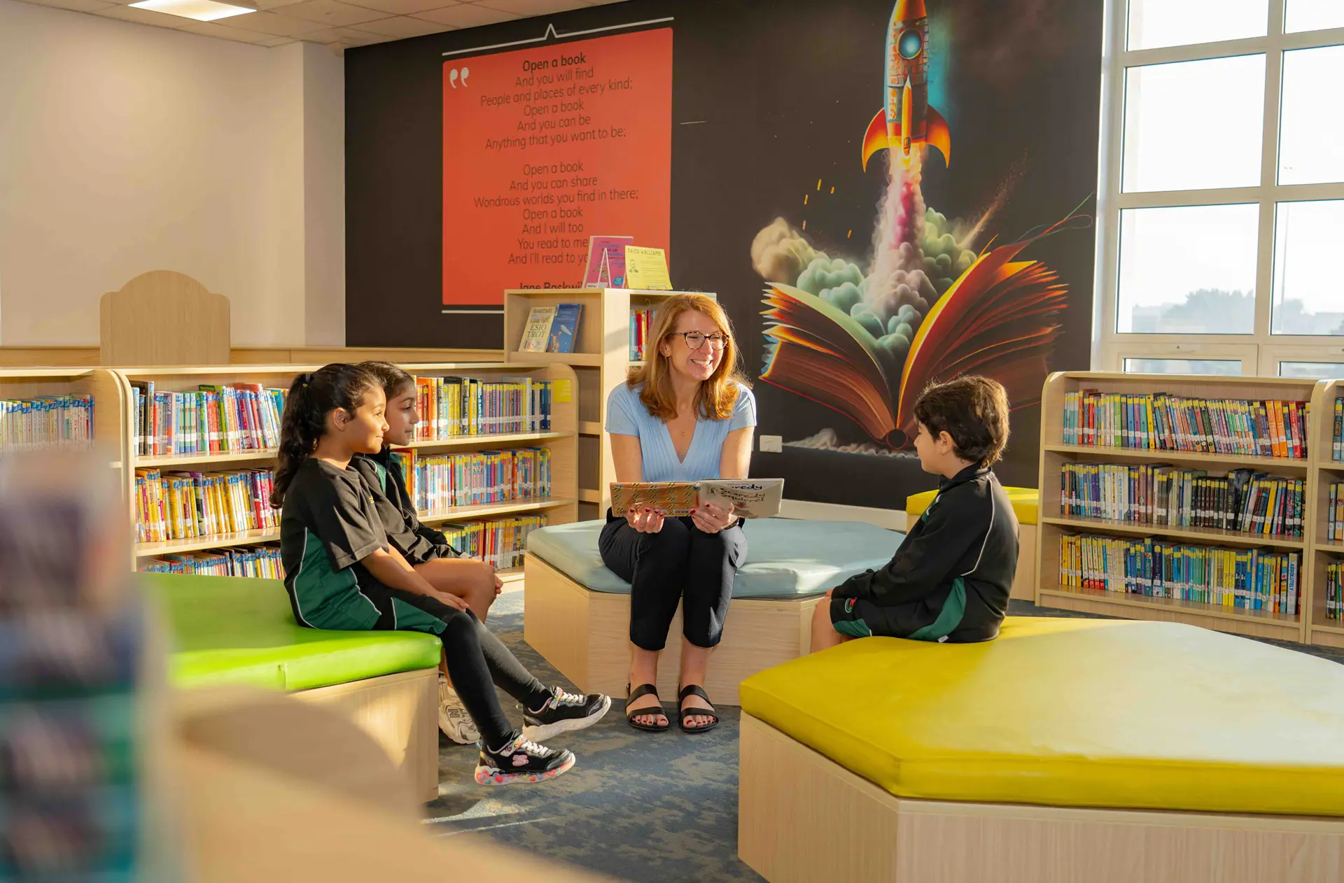 Teacher reading book to students