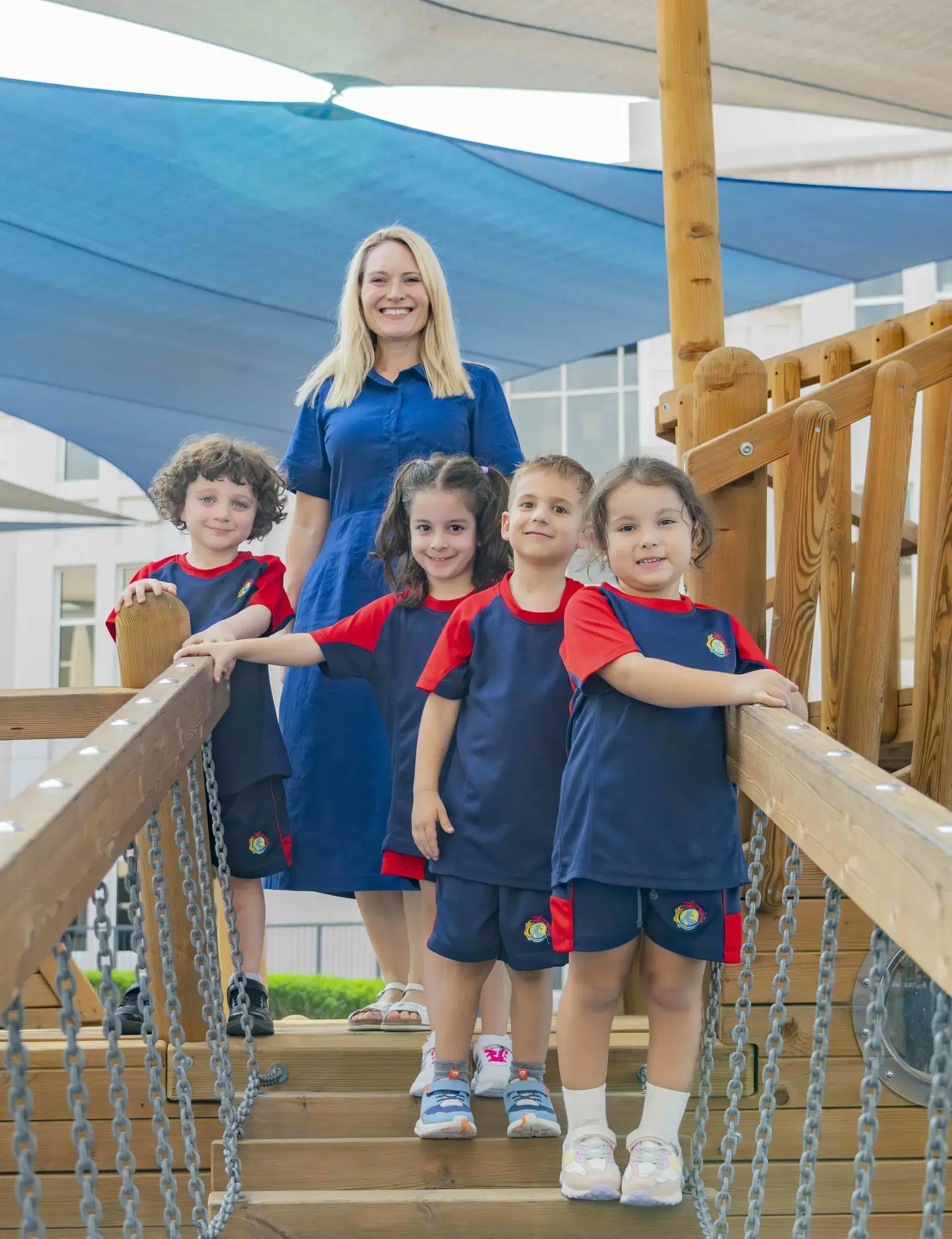 Teacher posing with early years students