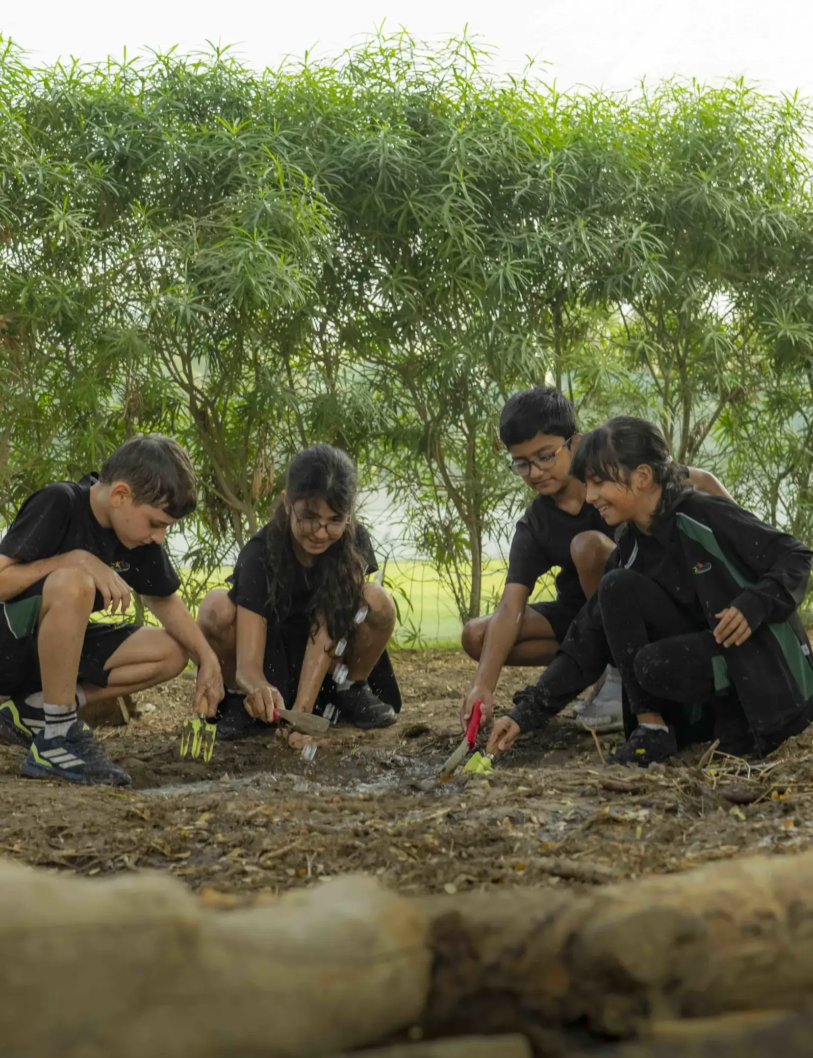 Students doing outdoor activities in forest school