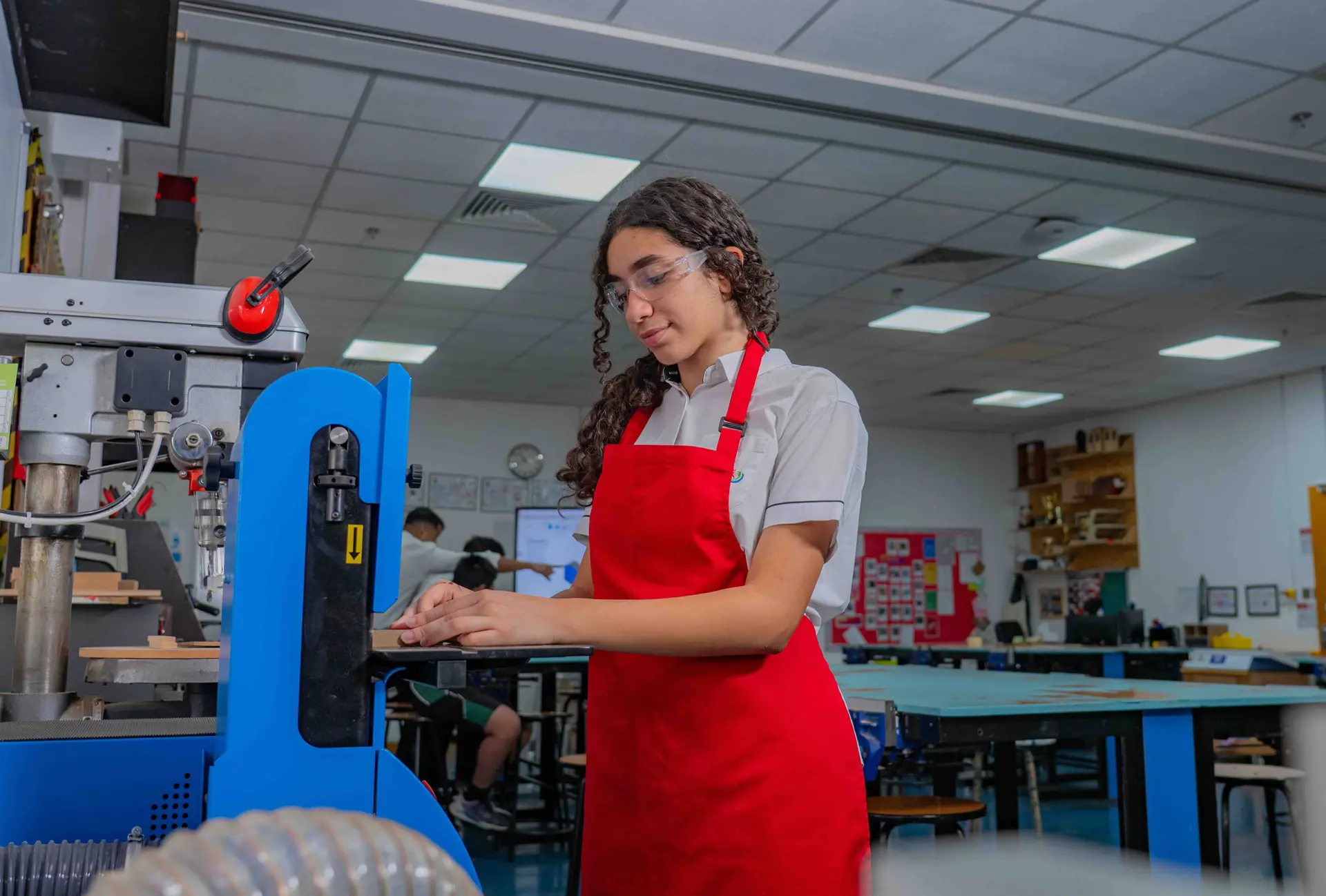 Student using belt-sander