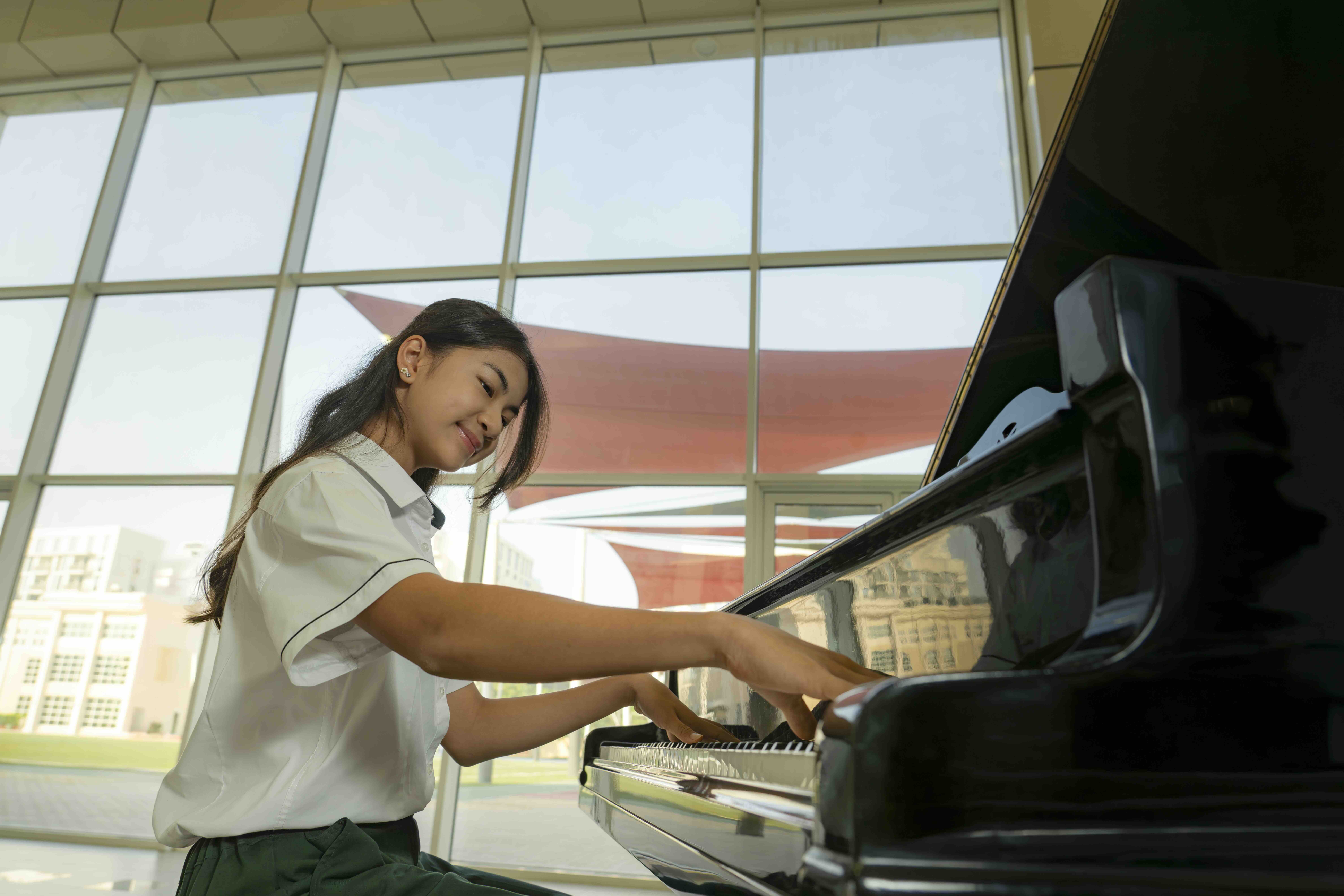 Student playing piano