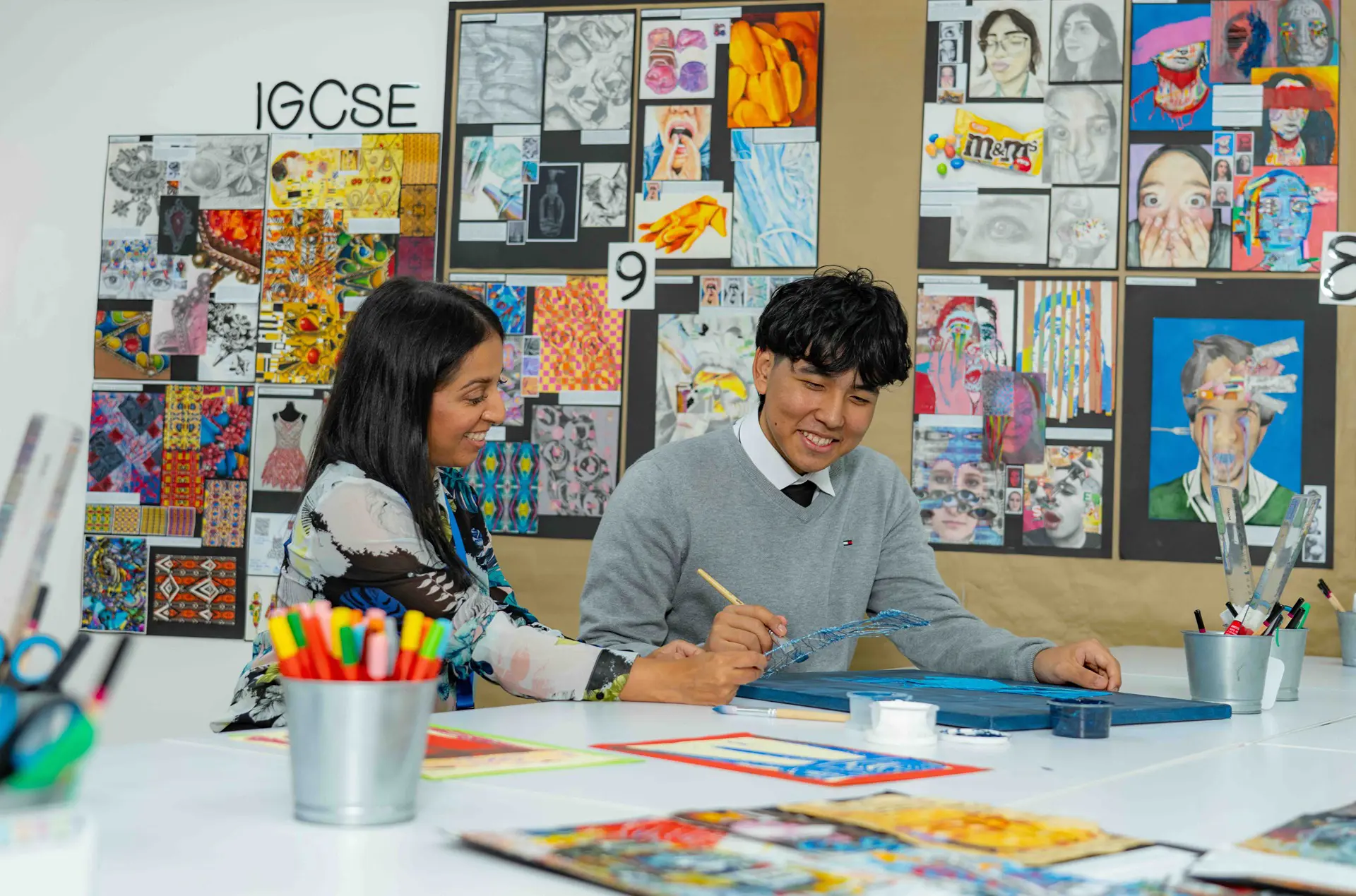 Sixth form student in art class with teacher