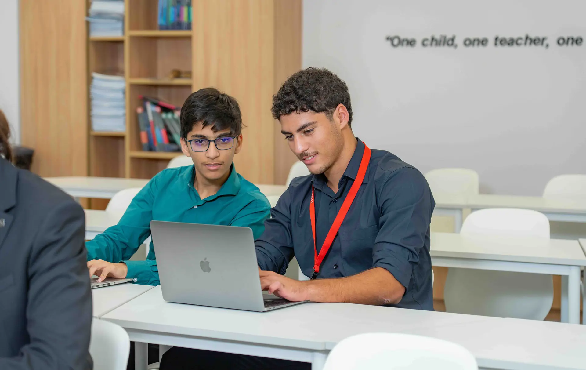 IB students in class on laptop